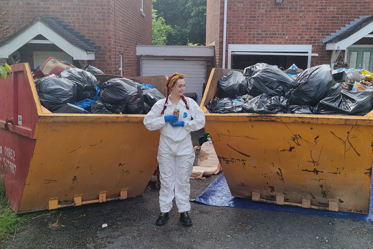 Completed house clearance with filled skips